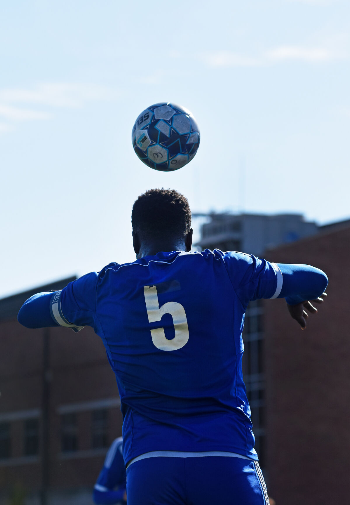 Anouar Adam throws the ball in to play